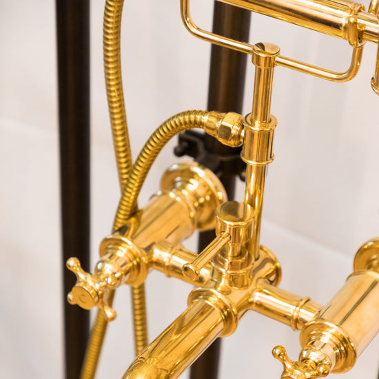Detail of the traditional solid brass Francone BT23Z wall-mounted bathroom bath filler tap and hand shower.