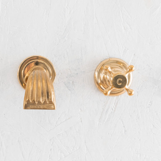 Francone BT31 wall-mounted bath filler faucet in unlacquered brass with a short waterfall spout.