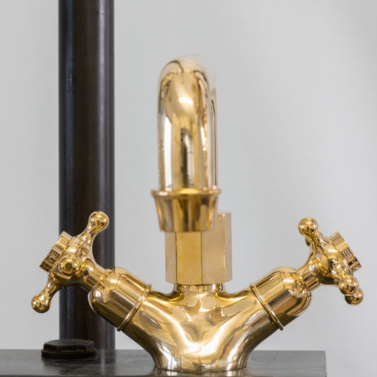 Francone BT36 single-hole traditional unlacquered brass tap featuring two cross-head handles and a swivel spout.