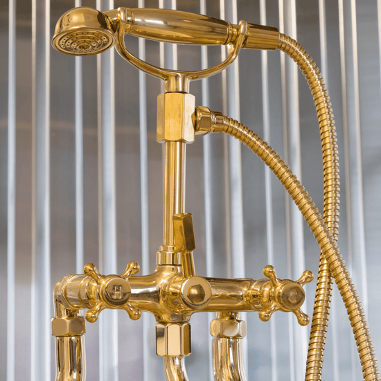 A detail of the traditional Francone BT3D unlacquered brass deck-mounted bath filler faucet, handcrafted in Italy.