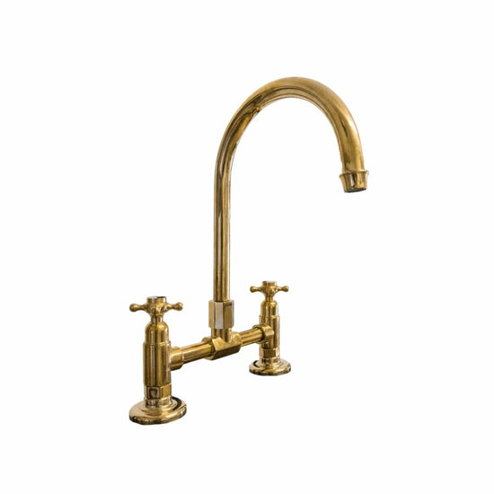 Traditional Francone BT49S kitchen tap and faucet in unlacquered brass, featuring a curved swivel spout.