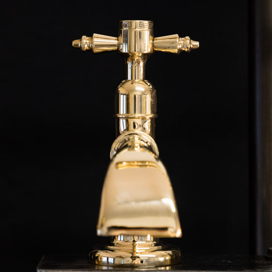 A Francone BT50D solid brass single pillar tap with a decorative waterfall spout for luxury bathrooms.