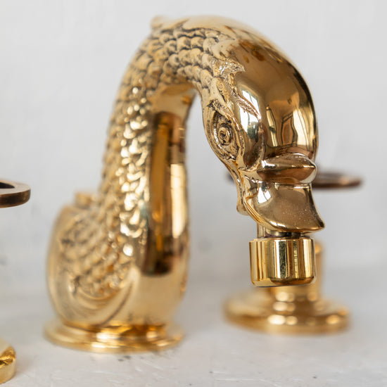 Detail of the Francone BT80B unlacquered brass swan bidet faucet, a traditional Italian design.