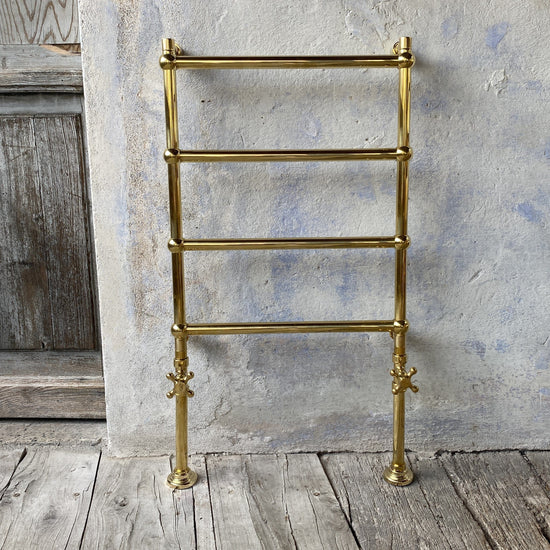 Traditional Francone BTR20 four-bar floor mounted heated towel rail in handcrafted unlacquered brass.