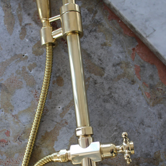 Detail of the traditional vintage Francone BTS13F unlacquered brass floor-mounted column shower.