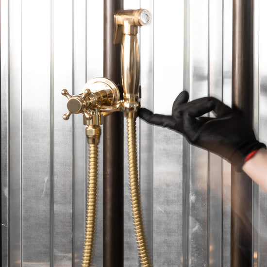 The Francone BTS20S traditional unlacquered brass wall mounted hand shower and bidet spray.