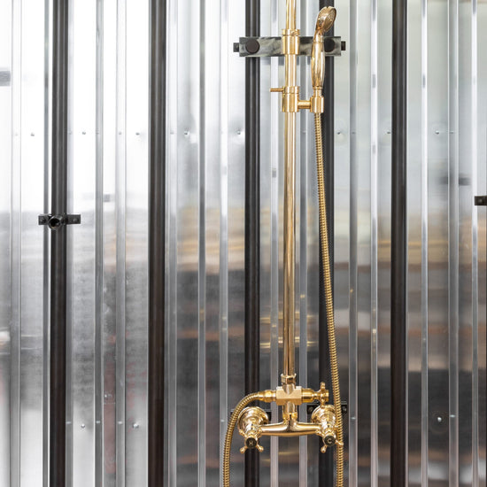 Traditional Francone BTS4 classic adjustable column shower in unlacquered brass with an adjustable hand shower.