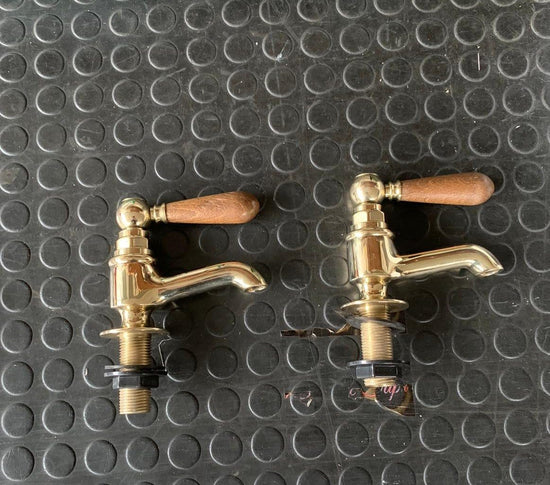 Traditional Francone BT15W unlacquered brass bathroom pillar taps, also known as faucets, with wooden lever handles.