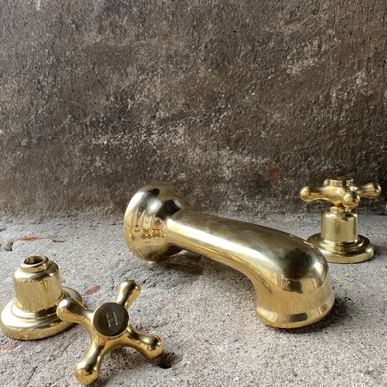 Vintage Francone BT92 unlacquered brass wall mounted bathroom faucet with classic cross tap handles.