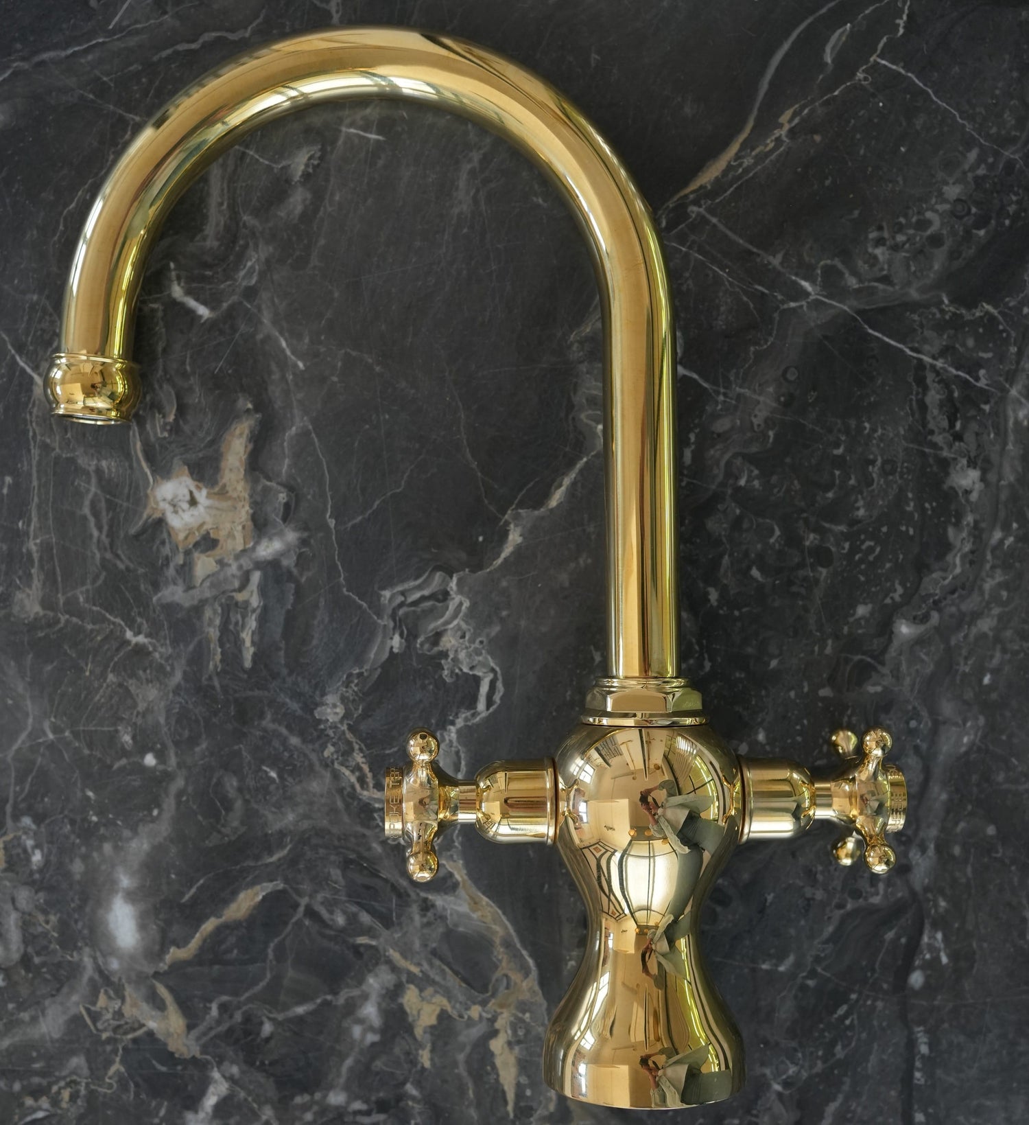 Traditional Francone BT100 unlacquered brass kitchen faucet with a curved spout and vintage handles.