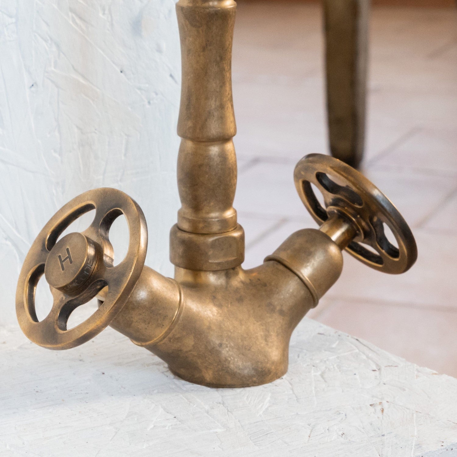 Close-up of the Francone BT11 solid brass bathroom tap, showcasing vintage industrial wheel handles.