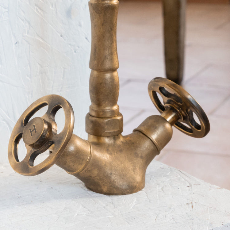 Close-up of the Francone BT11 solid brass bathroom tap, showcasing vintage industrial wheel handles.