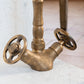 Close-up of the Francone BT11 solid brass bathroom tap, showcasing vintage industrial wheel handles.