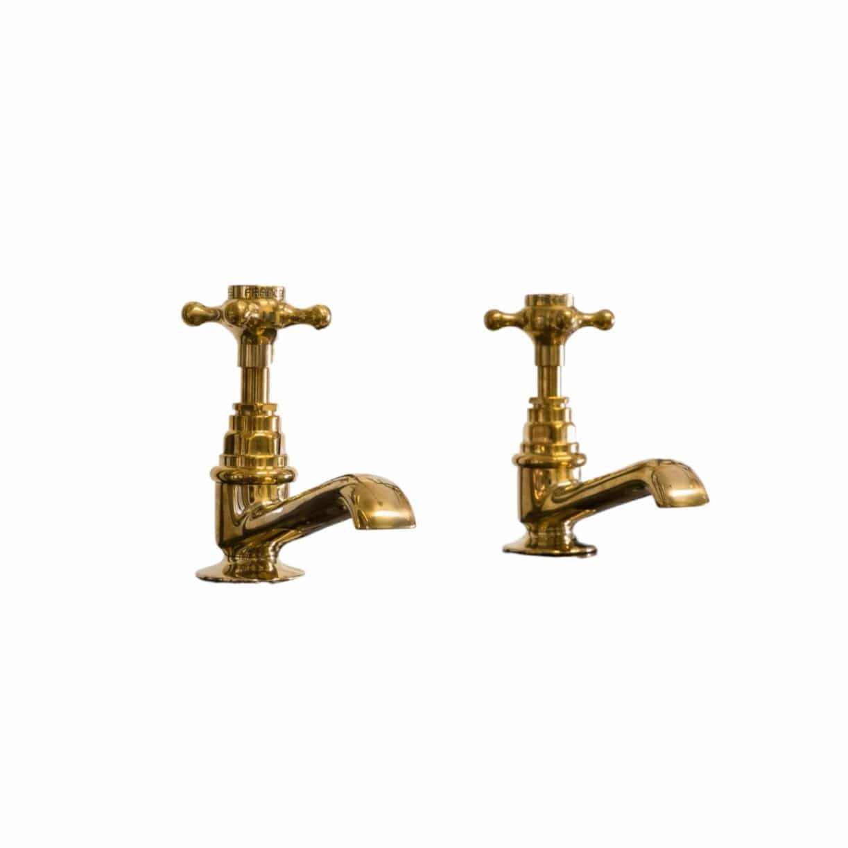 Pair of traditional Francone BT15 unlacquered brass pillar taps for a classic bathroom basin.