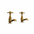 Pair of traditional Francone BT15 unlacquered brass pillar taps for a classic bathroom basin.