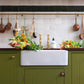 Traditional Francone BT16D unlacquered brass deck-mounted pillar taps installed on a kitchen sink.
