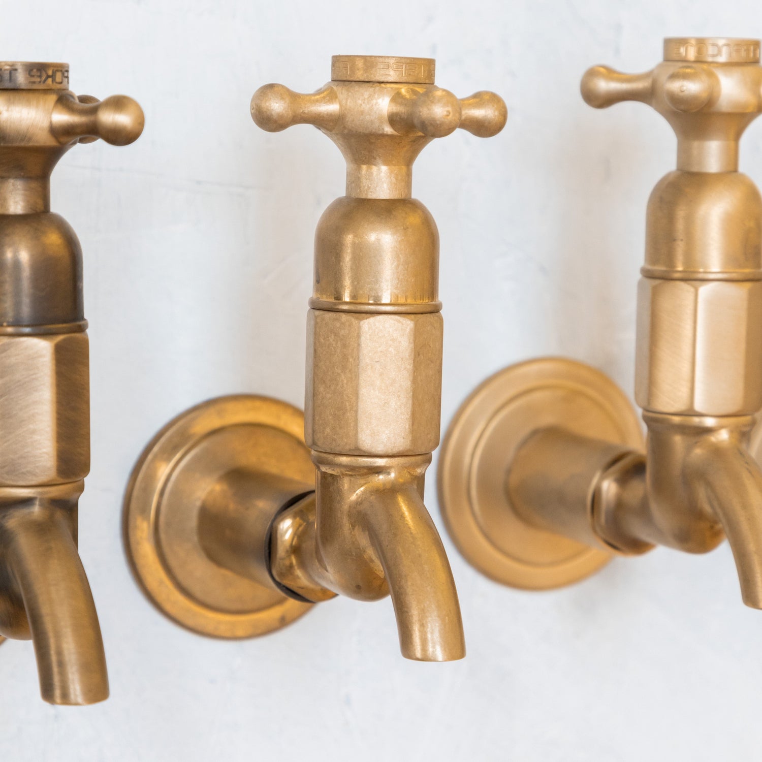 Traditional Francone BT16W wall-mounted bathroom taps in unlacquered brass, handcrafted in Italy.