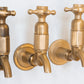 Traditional Francone BT16W wall-mounted bathroom taps in unlacquered brass, handcrafted in Italy.