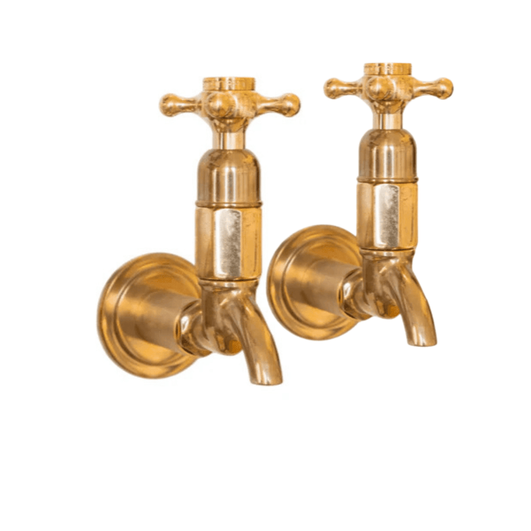 Francone BT16W traditional wall-mounted pillar taps in unlacquered brass, also known as basin faucets.