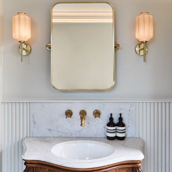 Traditional Francone BT18 unlacquered brass wall-mounted bathroom faucet on marble splashback by The TV Carpenter.