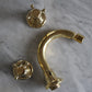 Francone BT1B traditional three-hole bidet faucet in unlacquered brass, deck mounted on marble.
