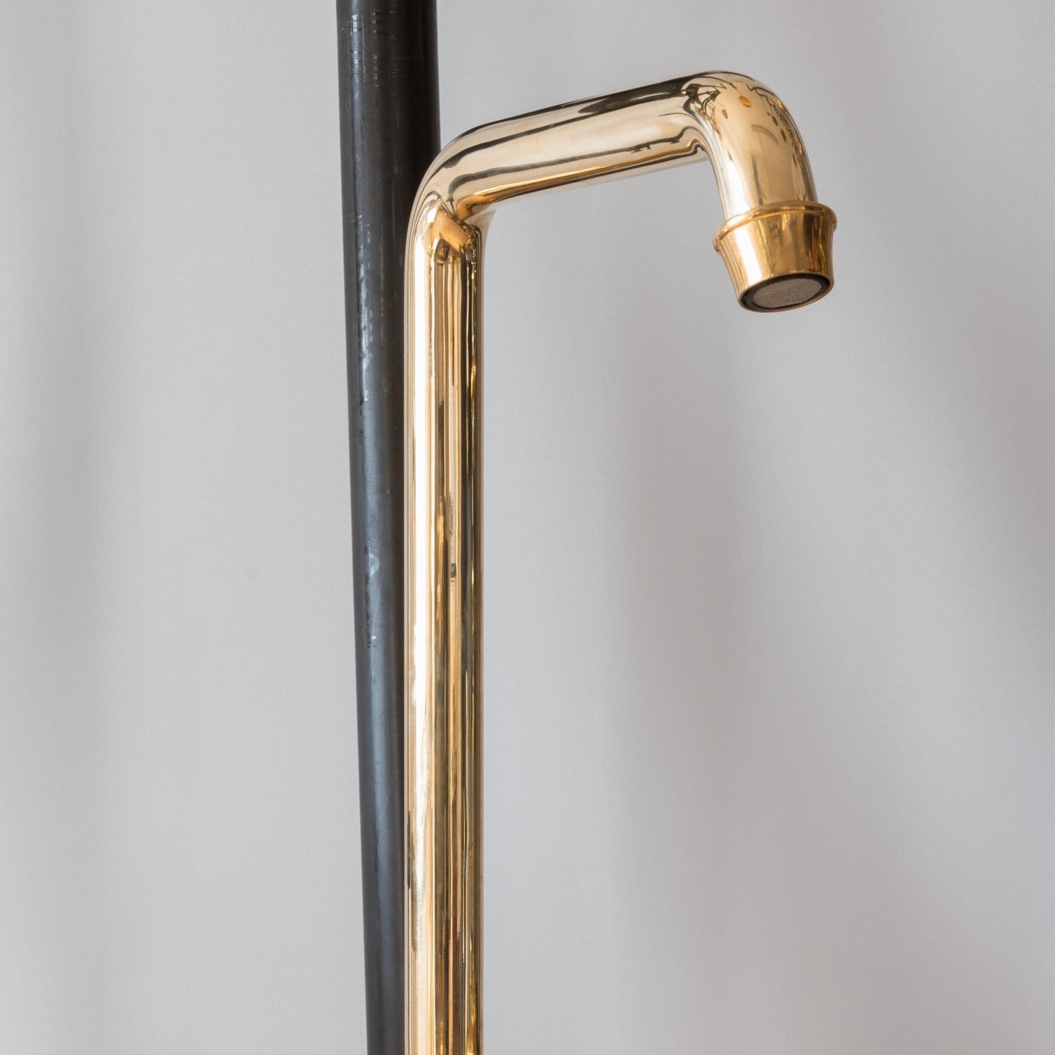 Detail of the Francone BT2 traditional wall-mounted unlacquered brass bathroom faucet swivel spout.