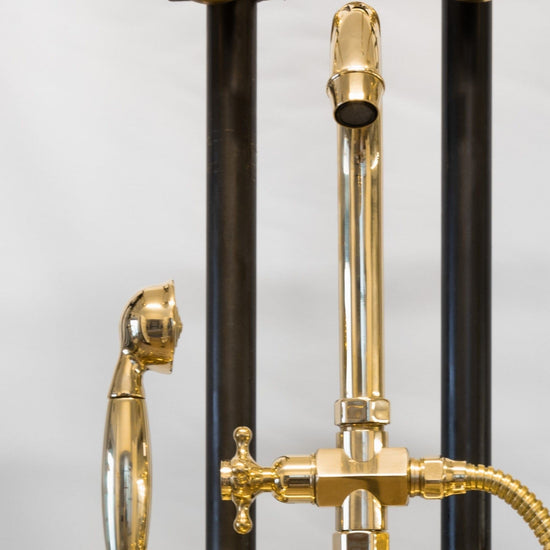 Detail of the traditional Francone BT22D solid brass deck-mounted bath faucet with hand shower.