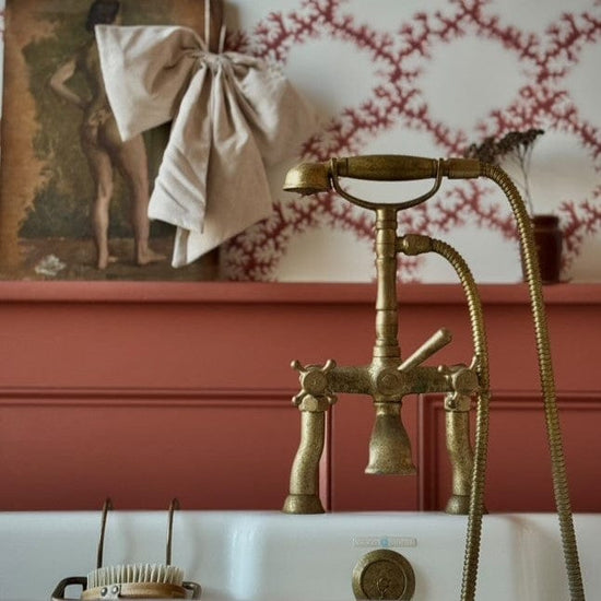 Traditional Francone BT23D solid brass deck-mounted bath filler faucet with hand shower in a bathroom.