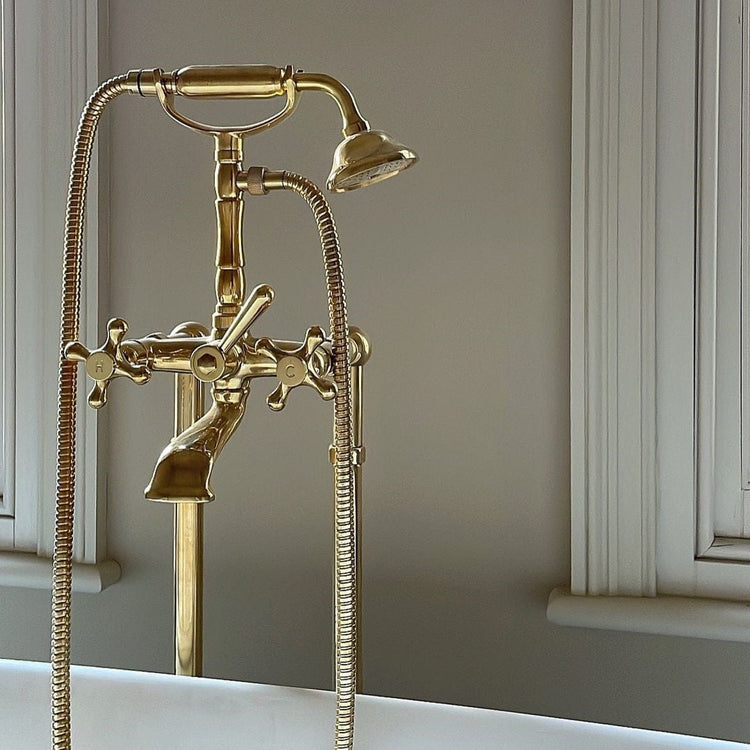 Francone BT23F traditional floor-mounted bathroom faucet with hand shower in unlacquered brass.