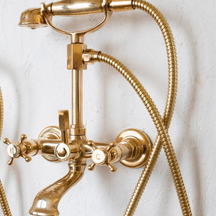 Francone BT23H traditional wall-mounted bath filler faucet in unlacquered brass with hexagonal handles.