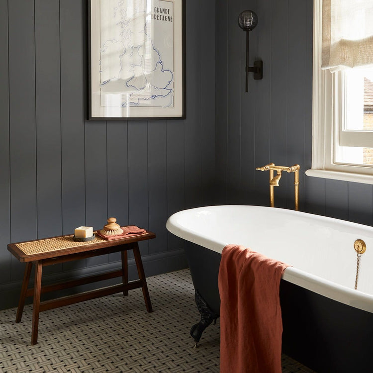 Traditional brass Francone BT25F floor-mounted bath faucet installed alongside a roll-top tub.