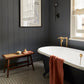 Traditional brass Francone BT25F floor-mounted bath faucet installed alongside a roll-top tub.
