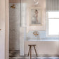 Traditional Francone BT26 unlacquered brass wall mounted bath filler faucet installed in a marble bathroom by Polly Ashman