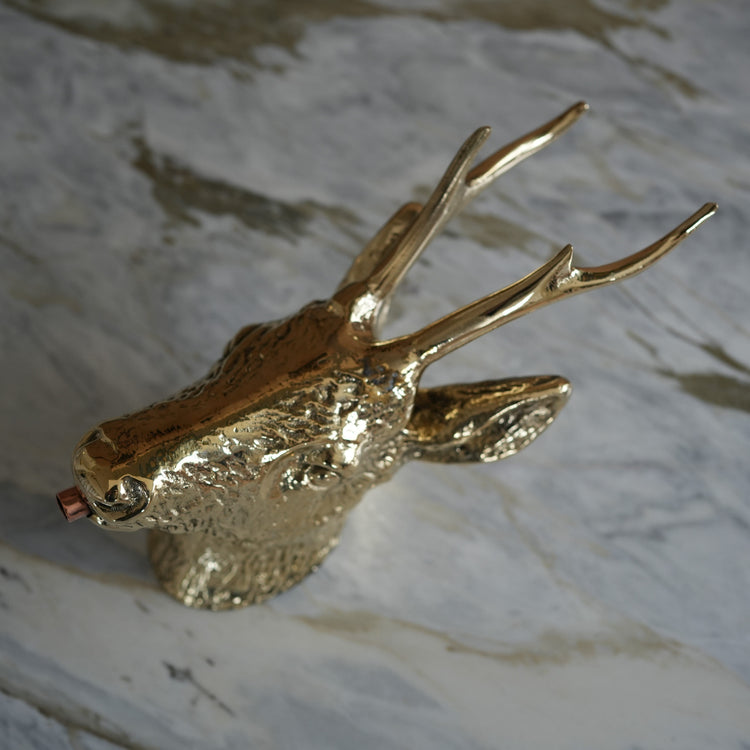 A close-up detail of the decorative Francone BT27 solid brass deer head faucet for a traditional bathroom tap.