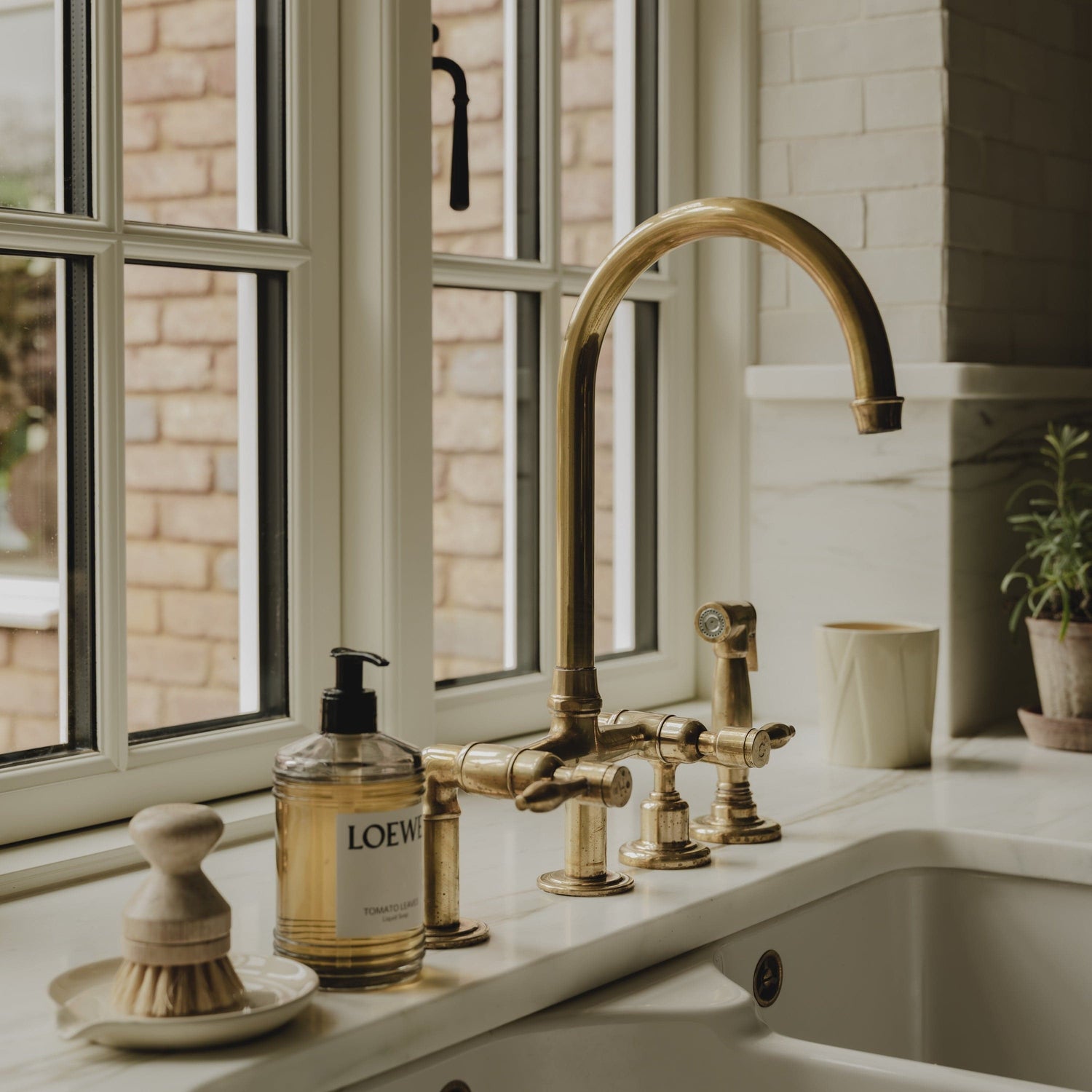 Installed Francone BT28Y traditional kitchen tap, also a faucet, in unlacquered brass with spray rinse.
