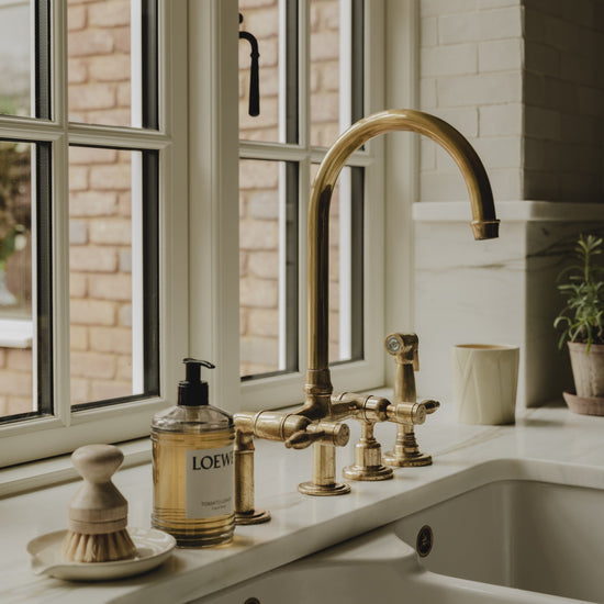Installed Francone BT28Y traditional kitchen tap, also a faucet, in unlacquered brass with spray rinse.