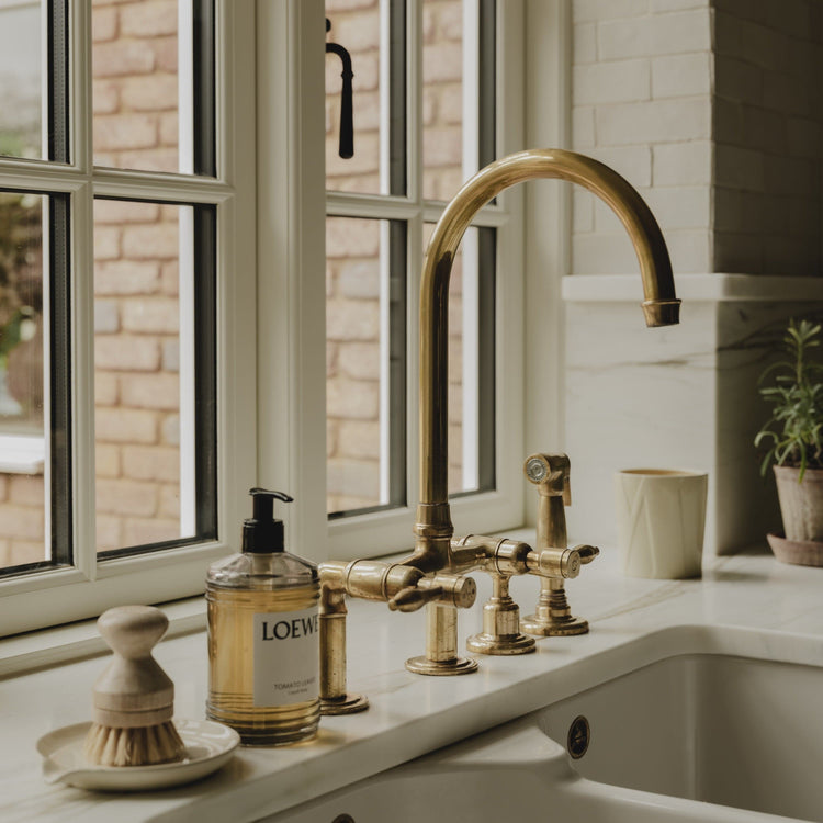 Installed Francone BT28Y traditional kitchen tap, also a faucet, in unlacquered brass with spray rinse.