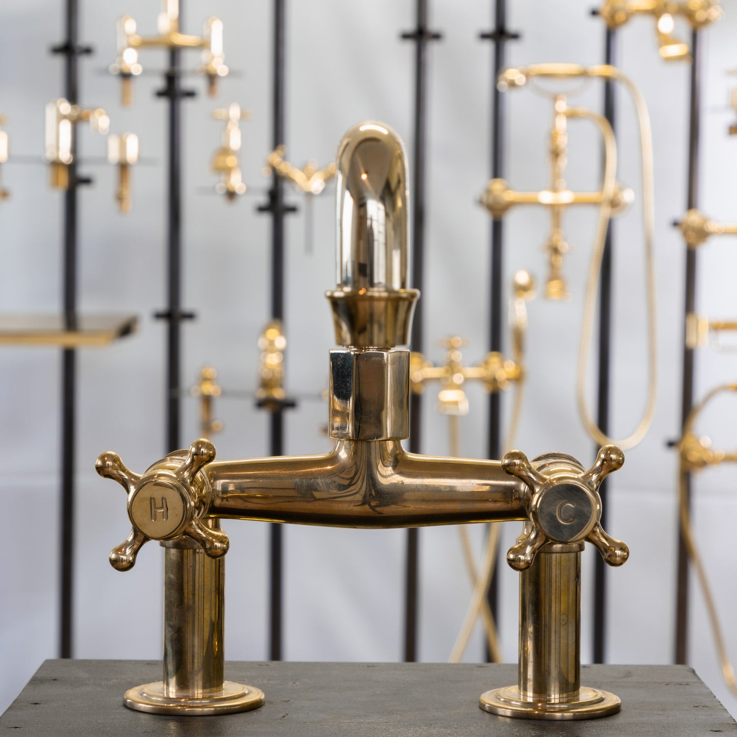 Francone BT29 traditional unlacquered brass deck mounted tap with double cross handles featuring H and C for hot and cold.