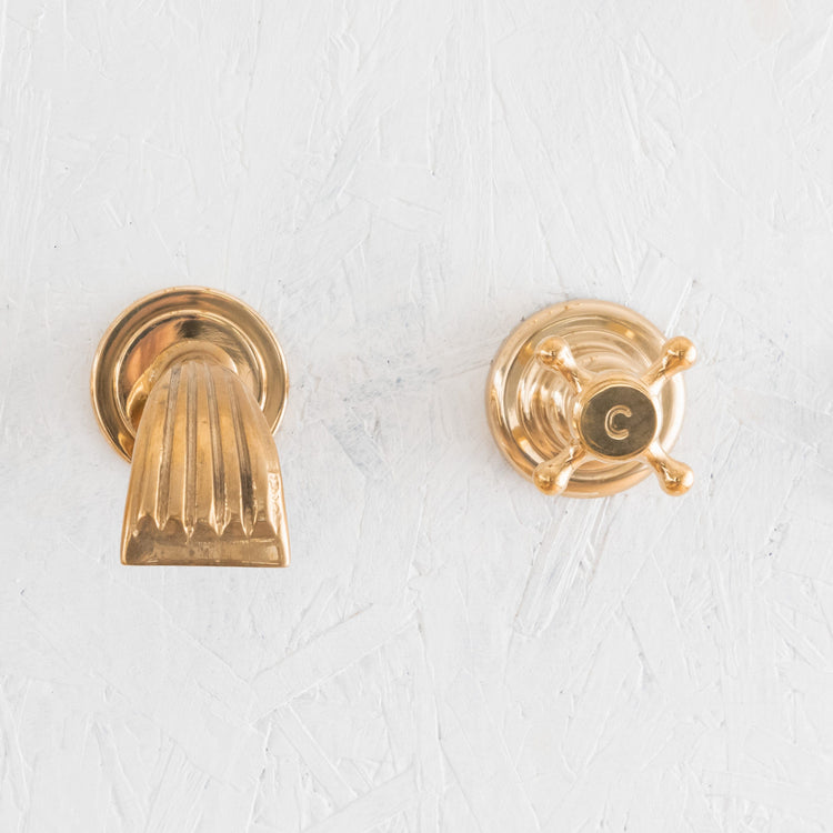 Francone BT31 wall-mounted bath filler faucet in unlacquered brass with a short waterfall spout.