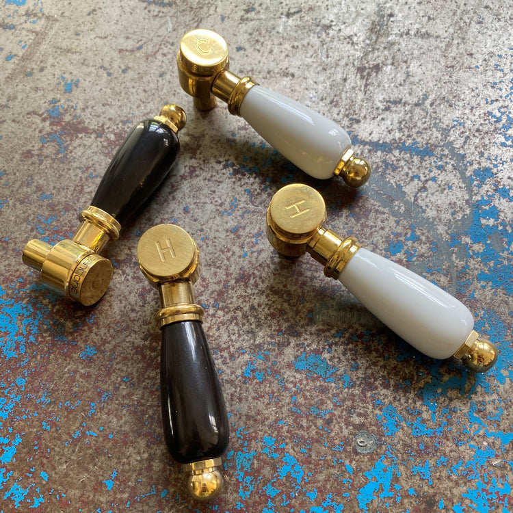 Traditional Francone BT34C bathroom faucet lever handles in black and white ceramic with solid brass.