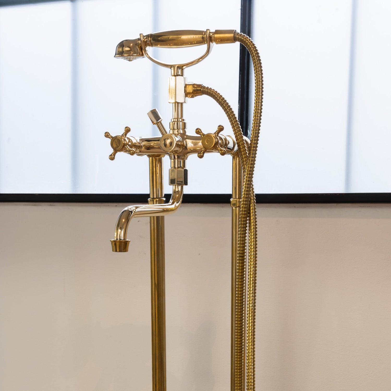 Traditional Francone BT3F unlacquered brass floor-mounted bath filler faucet with hand shower, made in Italy.