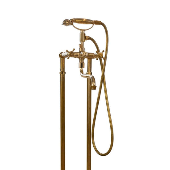 Traditional unlacquered brass floor-mounted bath filler faucet, Francone BT3F with hand shower and swivel spout.