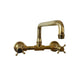 A traditional wall-mounted solid brass kitchen or bathroom faucet, the Francone BT40S double-handle tap.