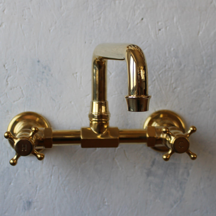 Traditional wall-mounted Francone BT40S solid brass bathroom faucet in an unlacquered finish.