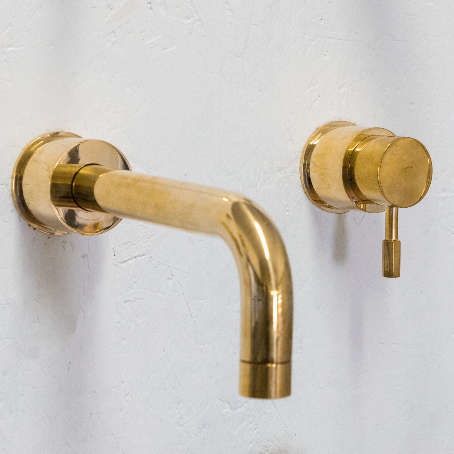 Francone BT42 solid brass wall-mounted mixer tap, a two-hole bathroom faucet with a curved spout.