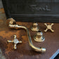 An unassembled Francone BT43 traditional unlacquered brass wall mounted bathroom faucet set with vintage star handles.