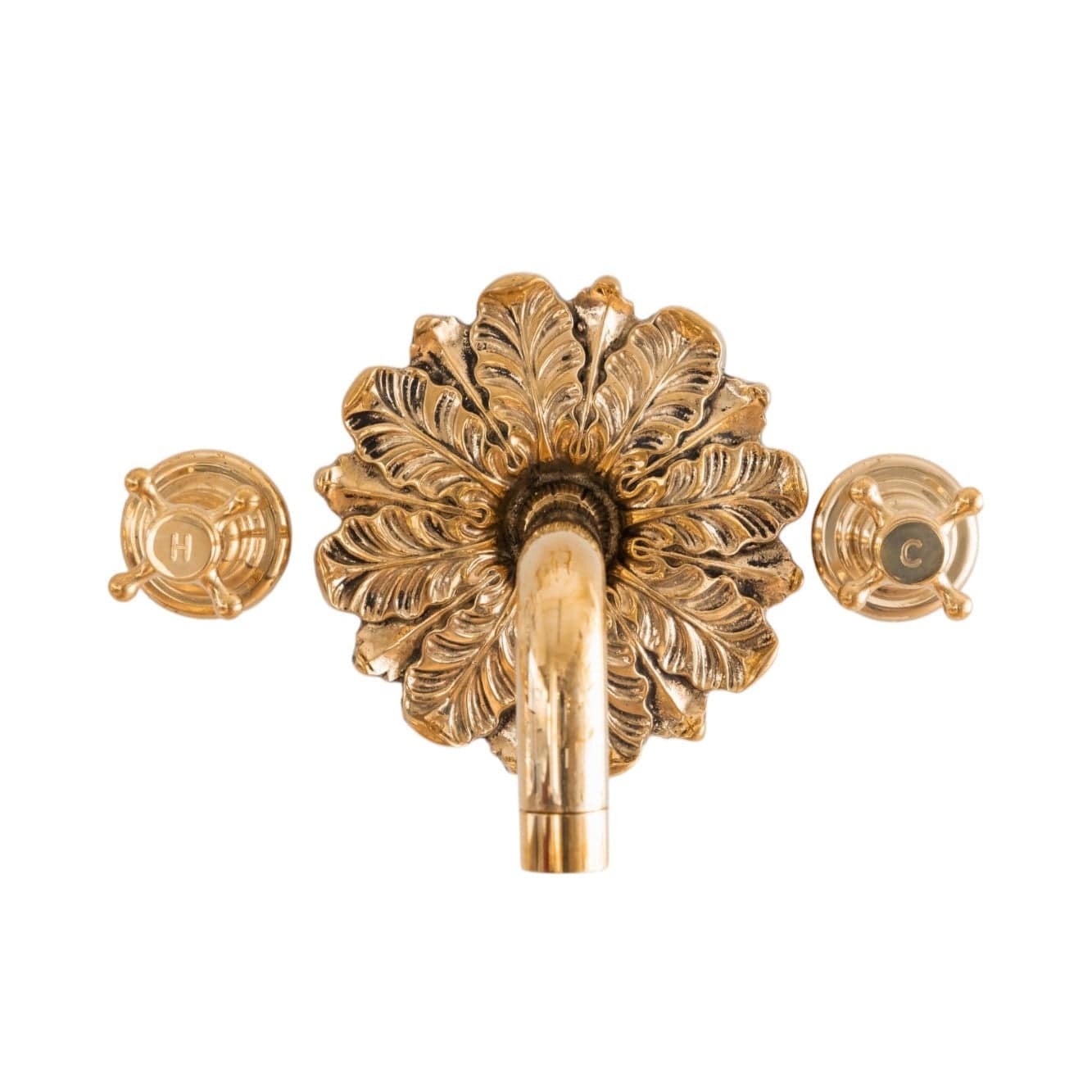 Francone BT44 wall mounted unlacquered brass taps feature an elaborate ornamental plate and separate hot and cold controls.