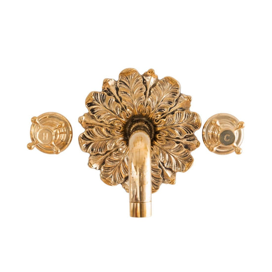 Francone BT44 wall mounted unlacquered brass taps feature an elaborate ornamental plate and separate hot and cold controls.