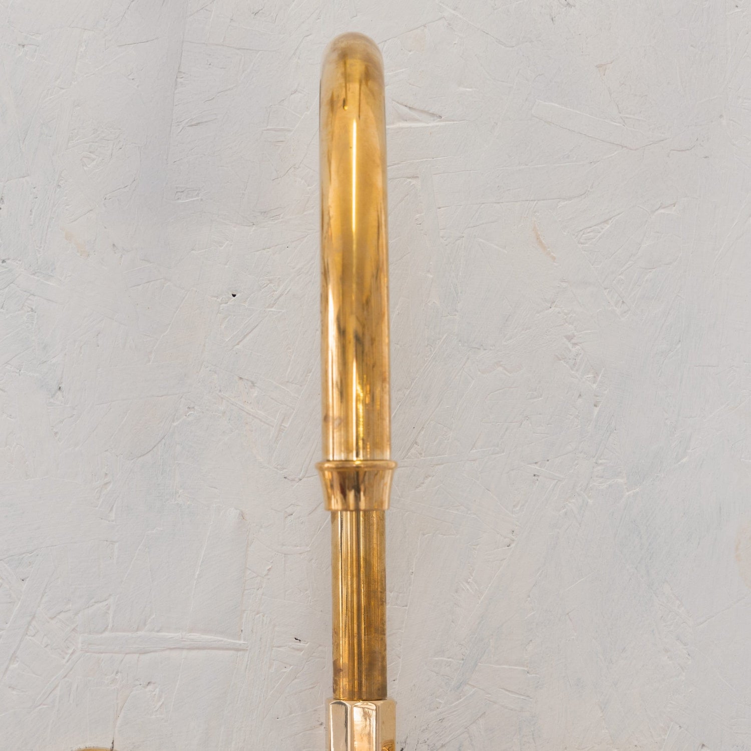 Detail of the Francone BT45 wall-mounted solid brass swivel spout bathroom faucet.