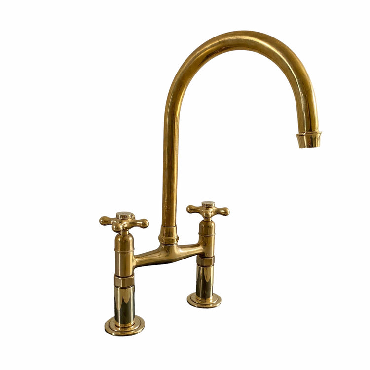 Traditional Francone BT49R unlacquered brass kitchen faucet with curved swivel spout.